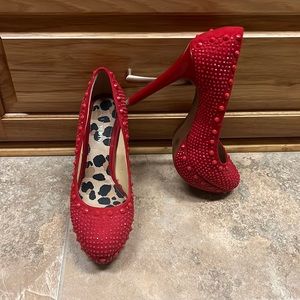gianni bini red heels, with cheetah on the inside, worn once, in grey condition